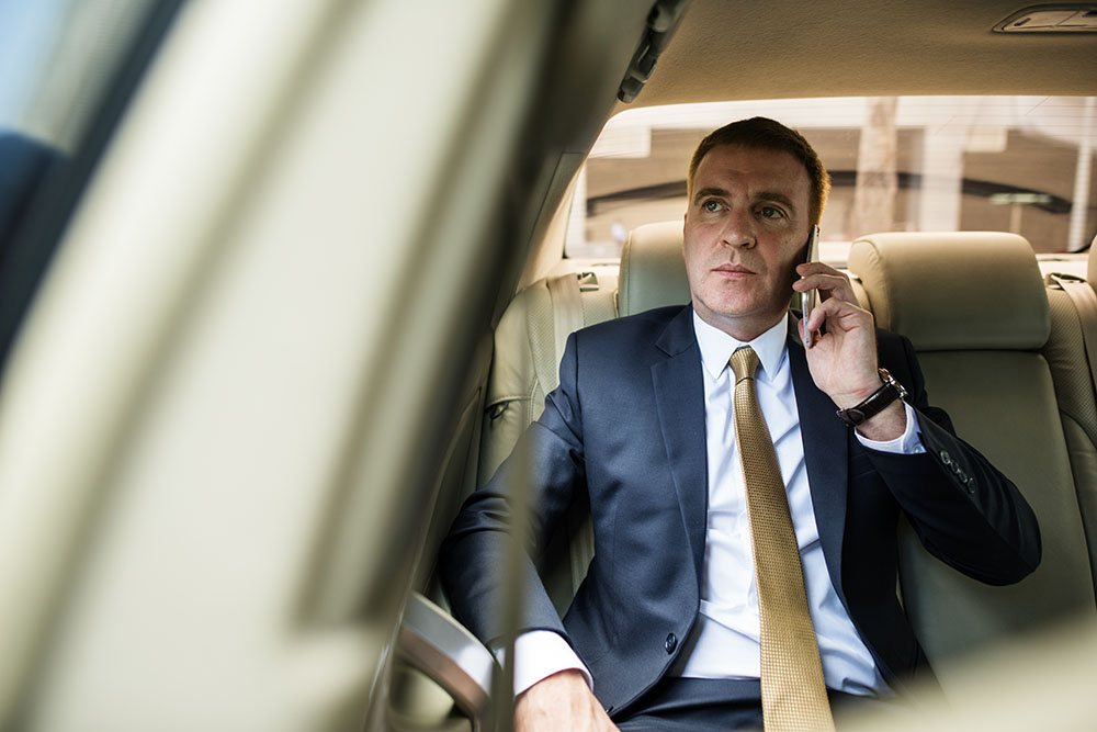 executive talking to the phone by la confidential car service