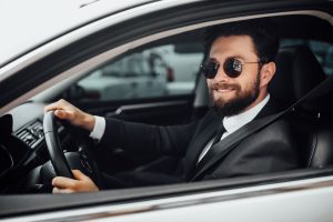 Handsome young smiling bearded driver